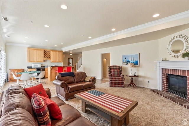 2010 E Rocklin Dr, Sandy, UT 84092 - living room with visible vents, recessed lighting, a brick fireplace, stairs, and crown molding