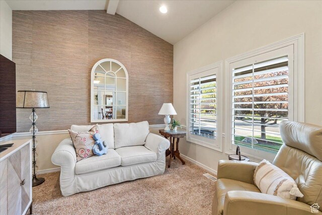 2010 E Rocklin Dr, Sandy, UT 84092 - carpeted living room featuring visible vents, plenty of natural light, vaulted ceiling with beams, and baseboards