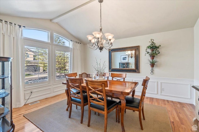 2010 E Rocklin Dr, Sandy, UT 84092 - dining area featuring lofted ceiling with beams, light wood-type flooring, wainscoting, visible vents, and a notable chandelier