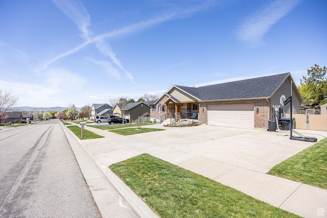 view of front facade with driveway, a shingled roof, an attached garage, a porch, and brick siding