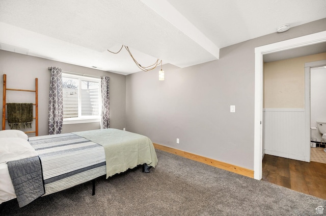 bedroom featuring wood finished floors and carpet floors