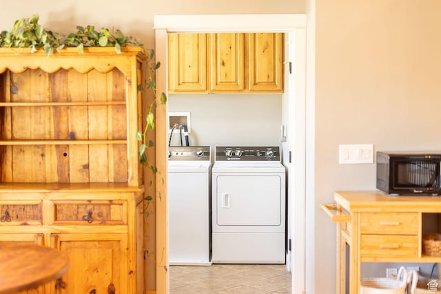 laundry room with light tile patterned floors and independent washer and dryer