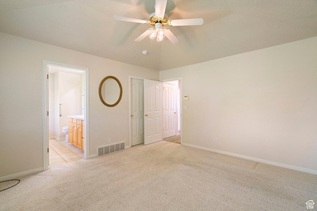 618 W 225 S, Layton, UT 84041 - unfurnished bedroom featuring visible vents, connected bathroom, baseboards, light colored carpet, and ceiling fan
