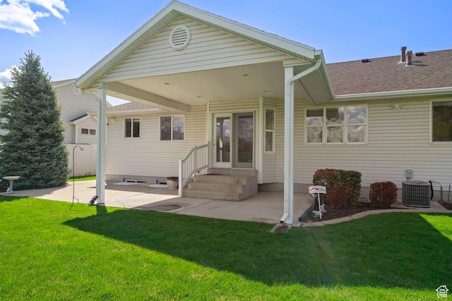 618 W 225 S, Layton, UT 84041 - rear view of house featuring a lawn, central air condition unit, a patio area, and a shingled roof