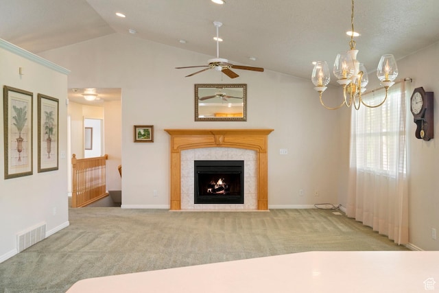 618 W 225 S, Layton, UT 84041 - unfurnished living room with a tile fireplace, carpet, vaulted ceiling, visible vents, and ceiling fan with notable chandelier