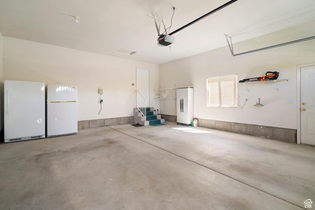 618 W 225 S, Layton, UT 84041 - garage with freestanding refrigerator and a garage door opener