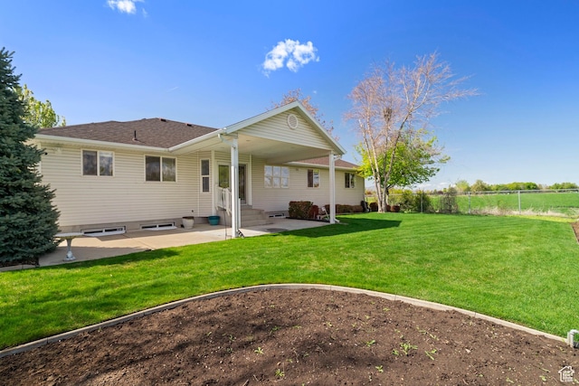 618 W 225 S, Layton, UT 84041 - back of house with fence, entry steps, a yard, and a patio