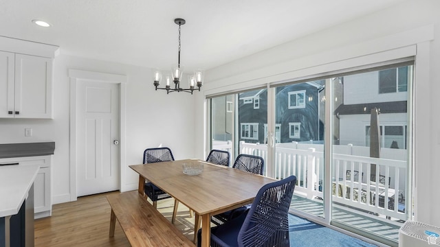 12373 S Pedroia St, Herriman, UT 84096 - dining room with a chandelier, light wood-type flooring, recessed lighting, and baseboards