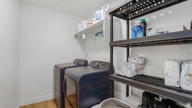 12373 S Pedroia St, Herriman, UT 84096 - laundry room with washing machine and dryer, wood finished floors, and baseboards