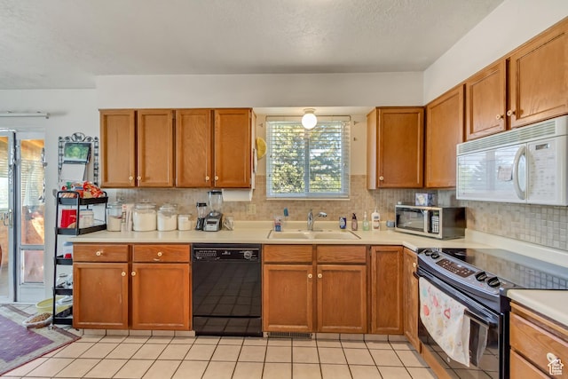 386 W 1125 N, Centerville, UT 84014 - kitchen with light countertops, a sink, and black appliances