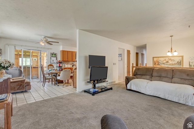 386 W 1125 N, Centerville, UT 84014 - living room featuring light tile patterned flooring, visible vents, a ceiling fan, and light carpet