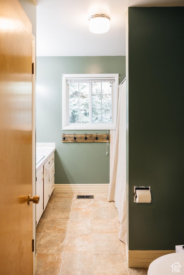 109 S 2nd W, Grace, ID 83241 - full bathroom with baseboards, visible vents, tile patterned flooring, and vanity