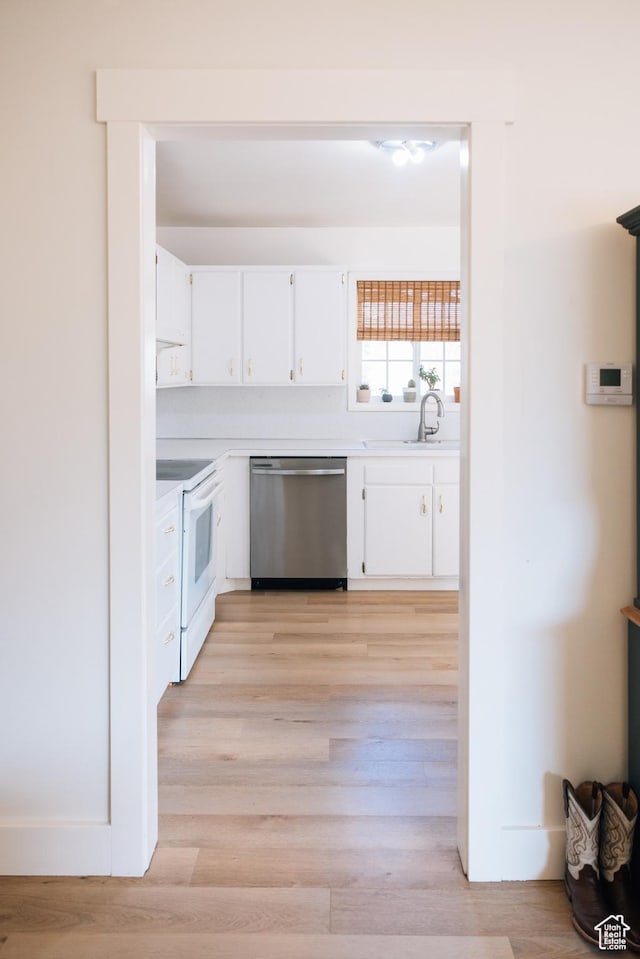 109 S 2nd W, Grace, ID 83241 - kitchen with a sink, dishwasher, light countertops, electric range, and white cabinets