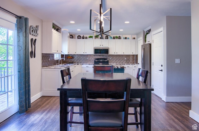 1896 N Main St, Orem, UT 84057 - kitchen featuring stainless steel appliances, baseboards, dark wood finished floors, and tasteful backsplash