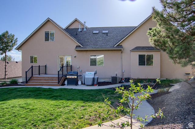 1896 N Main St, Orem, UT 84057 - back of property featuring a yard, a deck, roof with shingles, and stucco siding