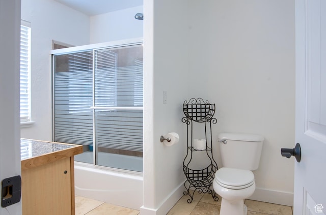 1896 N Main St, Orem, UT 84057 - full bath featuring baseboards, shower / bath combination with glass door, tile patterned floors, and toilet