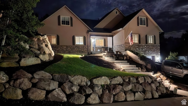 1896 N Main St, Orem, UT 84057 - back of house at night featuring stone siding and stucco siding