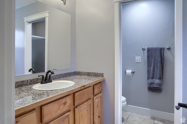 1896 N Main St, Orem, UT 84057 - bathroom featuring toilet, baseboards, tile patterned flooring, and vanity