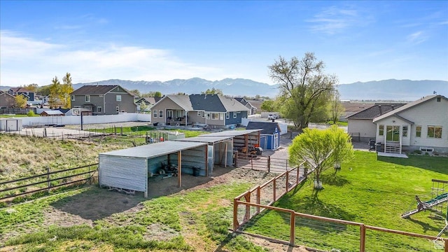 4206 Rose Springs Rd, Erda, UT 84074 - view of yard with a residential view, an outdoor structure, a mountain view, and an exterior structure