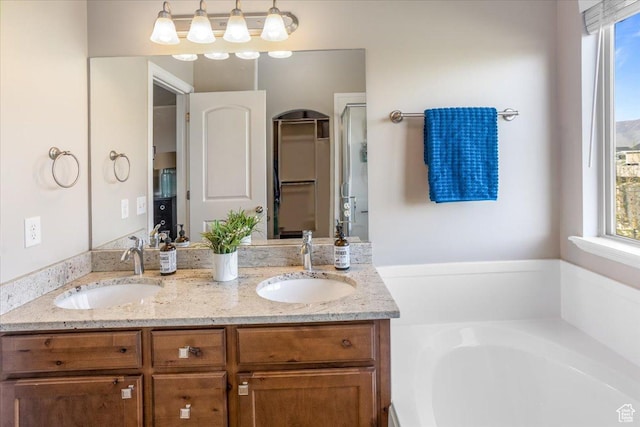 4206 Rose Springs Rd, Erda, UT 84074 - full bathroom with a garden tub, double vanity, and a shower stall