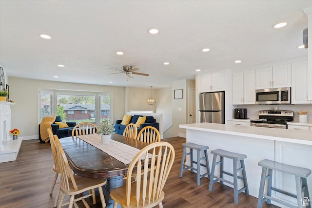 dining room with recessed lighting, baseboards, dark wood-style floors, and ceiling fan