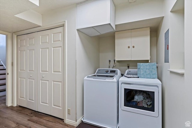 washroom with dark wood finished floors, separate washer and dryer, and baseboards
