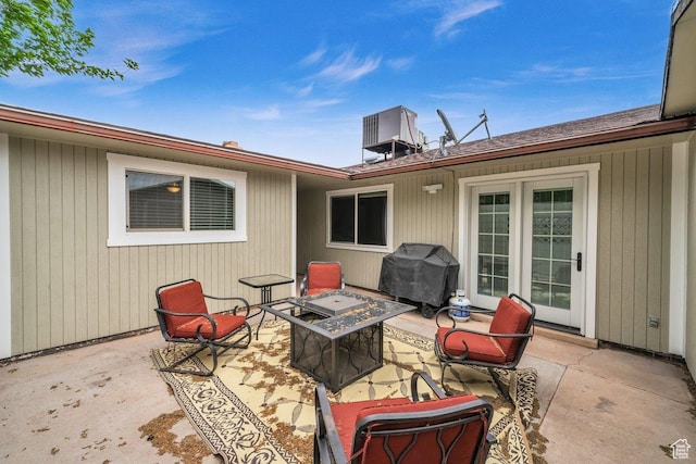 view of patio with a fire pit and a grill