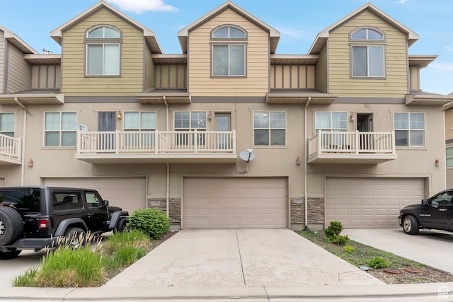 577 E 1590 S, Lehi, UT 84043 - townhome / multi-family property with a garage, driveway, stone siding, and stucco siding