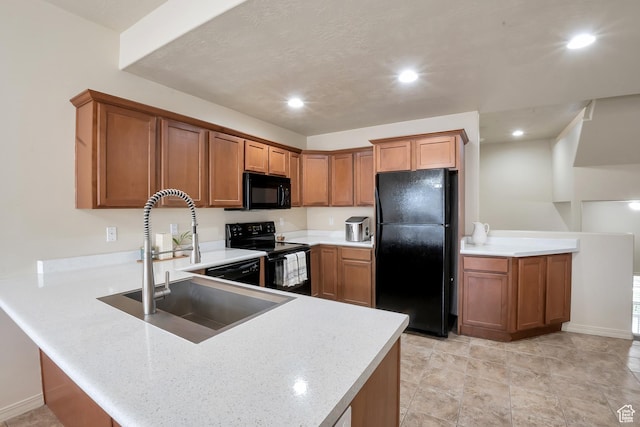 577 E 1590 S, Lehi, UT 84043 - kitchen featuring a peninsula, a sink, baseboards, brown cabinetry, and black appliances