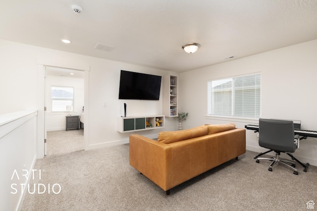 living area with light colored carpet, baseboards, visible vents, and recessed lighting