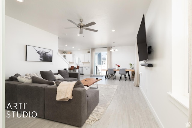 living area with ceiling fan, recessed lighting, and light wood-type flooring