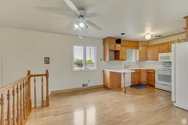 2344 E Arnett Dr, Millcreek, UT 84109 - kitchen featuring a sink, visible vents, white appliances, ceiling fan, and light countertops