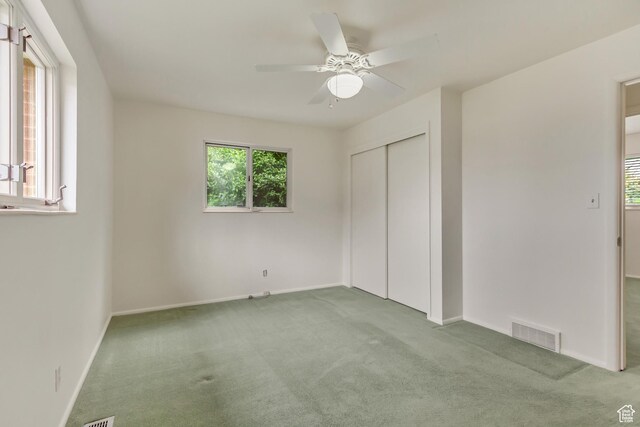 2344 E Arnett Dr, Millcreek, UT 84109 - unfurnished bedroom featuring a closet, visible vents, carpet flooring, and baseboards