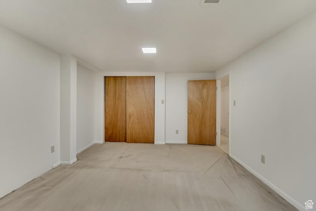 2344 E Arnett Dr, Millcreek, UT 84109 - unfurnished bedroom with baseboards, a closet, and light colored carpet