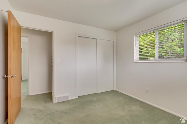 2344 E Arnett Dr, Millcreek, UT 84109 - unfurnished bedroom with carpet floors, a closet, visible vents, and baseboards