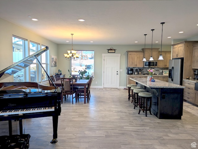 627 W Olympic Ln, Elk Ridge, UT 84651 - interior space with recessed lighting, light wood-style flooring, baseboards, and a notable chandelier