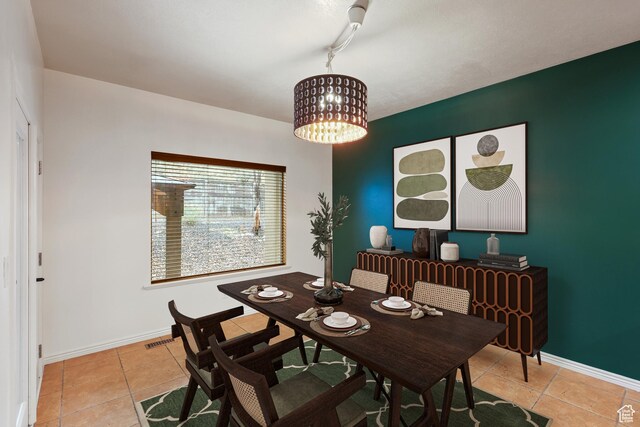 9226 N Mount Airey Dr W, Eagle Mountain, UT 84005 - dining area with a chandelier, light tile patterned floors, and baseboards