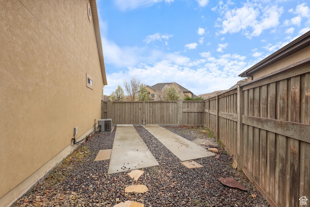 9226 N Mount Airey Dr W, Eagle Mountain, UT 84005 - fenced backyard with a patio area and central air condition unit