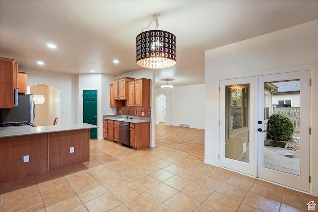 9226 N Mount Airey Dr W, Eagle Mountain, UT 84005 - kitchen featuring arched walkways, freestanding refrigerator, a sink, dishwashing machine, and recessed lighting