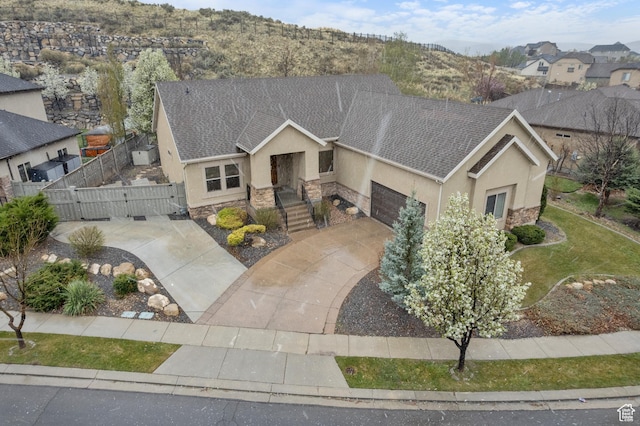9226 N Mount Airey Dr W, Eagle Mountain, UT 84005 - view of front of house featuring stone siding, stucco siding, a gate, a garage, and roof with shingles