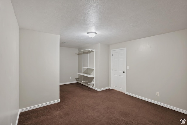 9226 N Mount Airey Dr W, Eagle Mountain, UT 84005 - basement with a textured ceiling, dark carpet, and baseboards