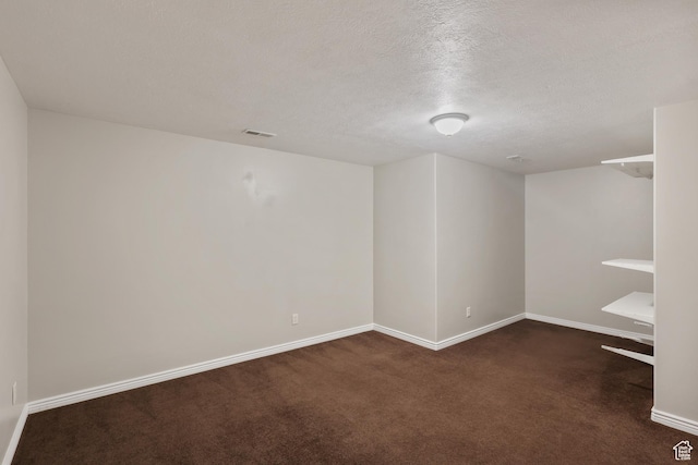 9226 N Mount Airey Dr W, Eagle Mountain, UT 84005 - spare room with dark carpet, baseboards, and a textured ceiling