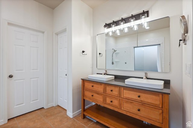 9226 N Mount Airey Dr W, Eagle Mountain, UT 84005 - bathroom featuring tile patterned floors, a shower, double vanity, and baseboards