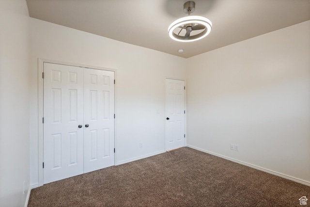 9226 N Mount Airey Dr W, Eagle Mountain, UT 84005 - unfurnished bedroom with dark colored carpet, baseboards, and a closet