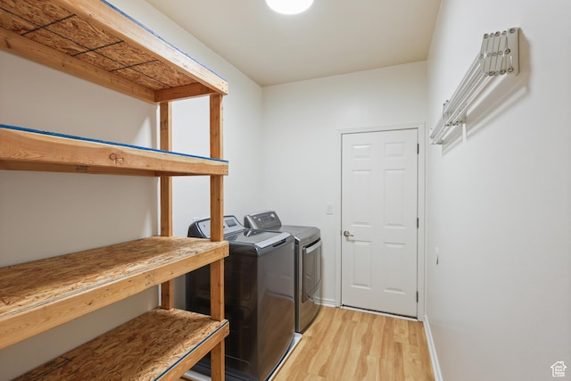 9226 N Mount Airey Dr W, Eagle Mountain, UT 84005 - laundry area with light wood-style flooring, independent washer and dryer, and baseboards