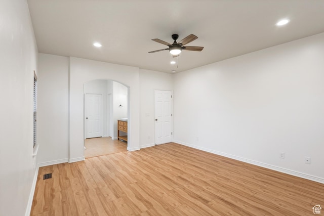 9226 N Mount Airey Dr W, Eagle Mountain, UT 84005 - empty room featuring arched walkways, a ceiling fan, light wood-style flooring, baseboards, and recessed lighting