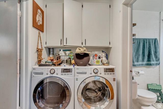 washroom with laundry area and washer and clothes dryer