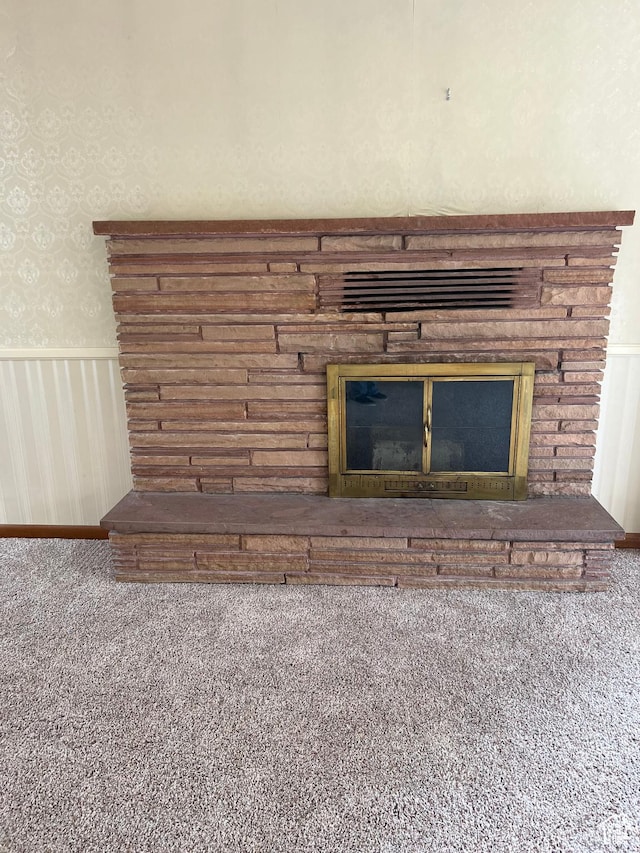 273 S 7th St S, Montpelier, ID 83254 - detailed view of a wainscoted wall, a glass covered fireplace, carpet floors, and wallpapered walls