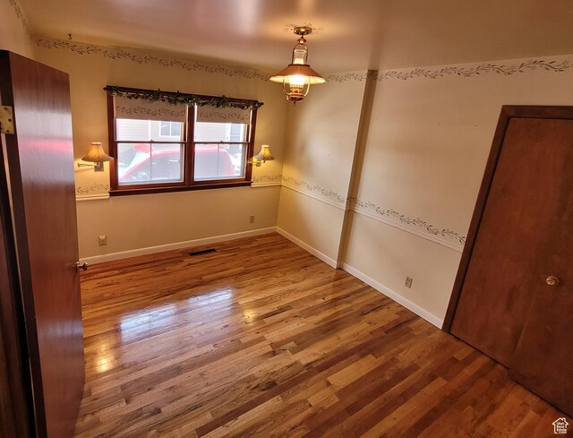 273 S 7th St S, Montpelier, ID 83254 - empty room with wood finished floors and baseboards