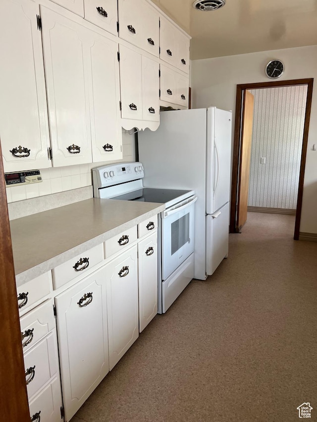 273 S 7th St S, Montpelier, ID 83254 - kitchen with electric stove, white cabinetry, decorative backsplash, and light countertops